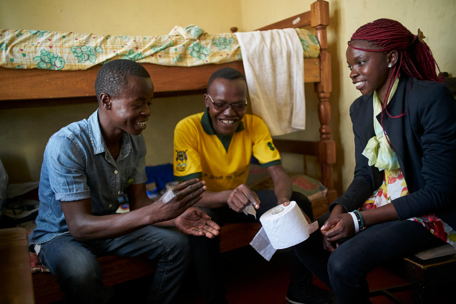 Dawwing Ouma (left), Collins Odour (middle) and Laura Adema (right) are peer counselors with Sauti Skika, a network of young people living with or are affected by HIV in Kenya. 