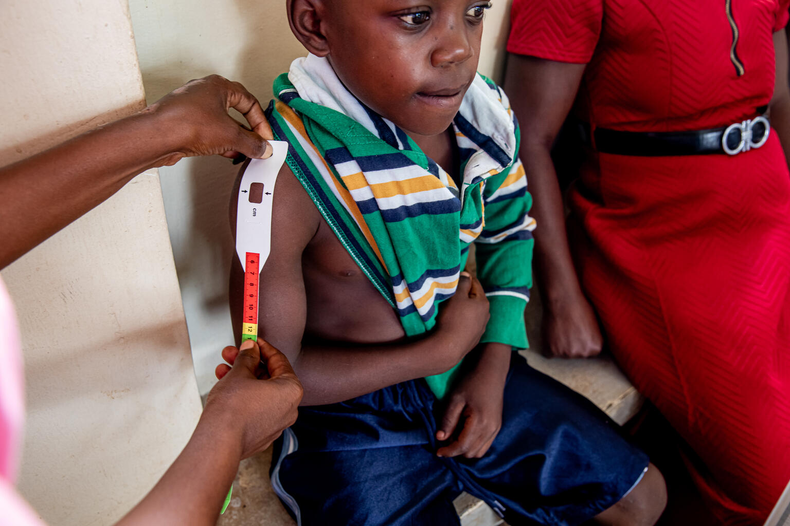 A young child receiving ART medication 