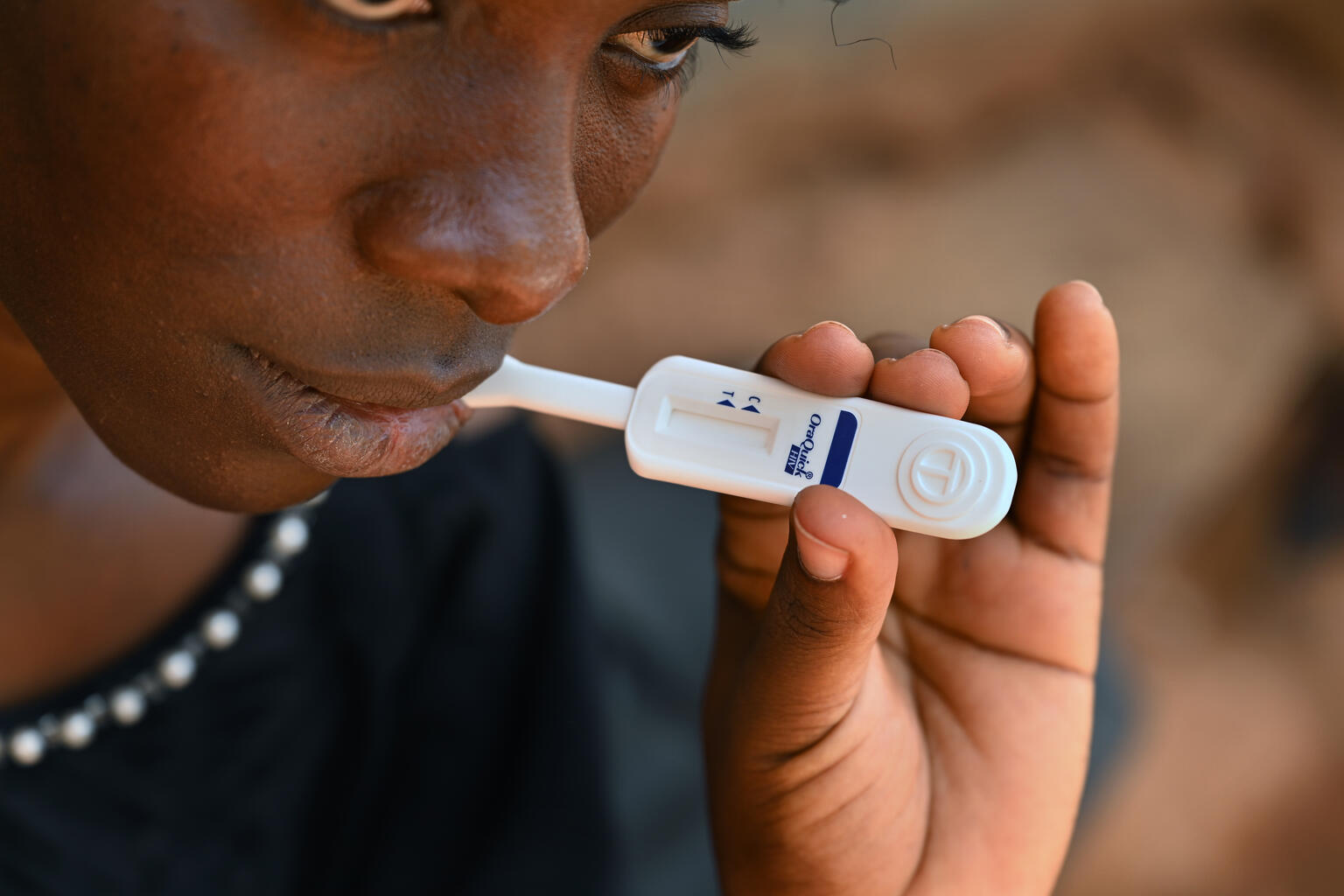 Young person taking a self hiv test